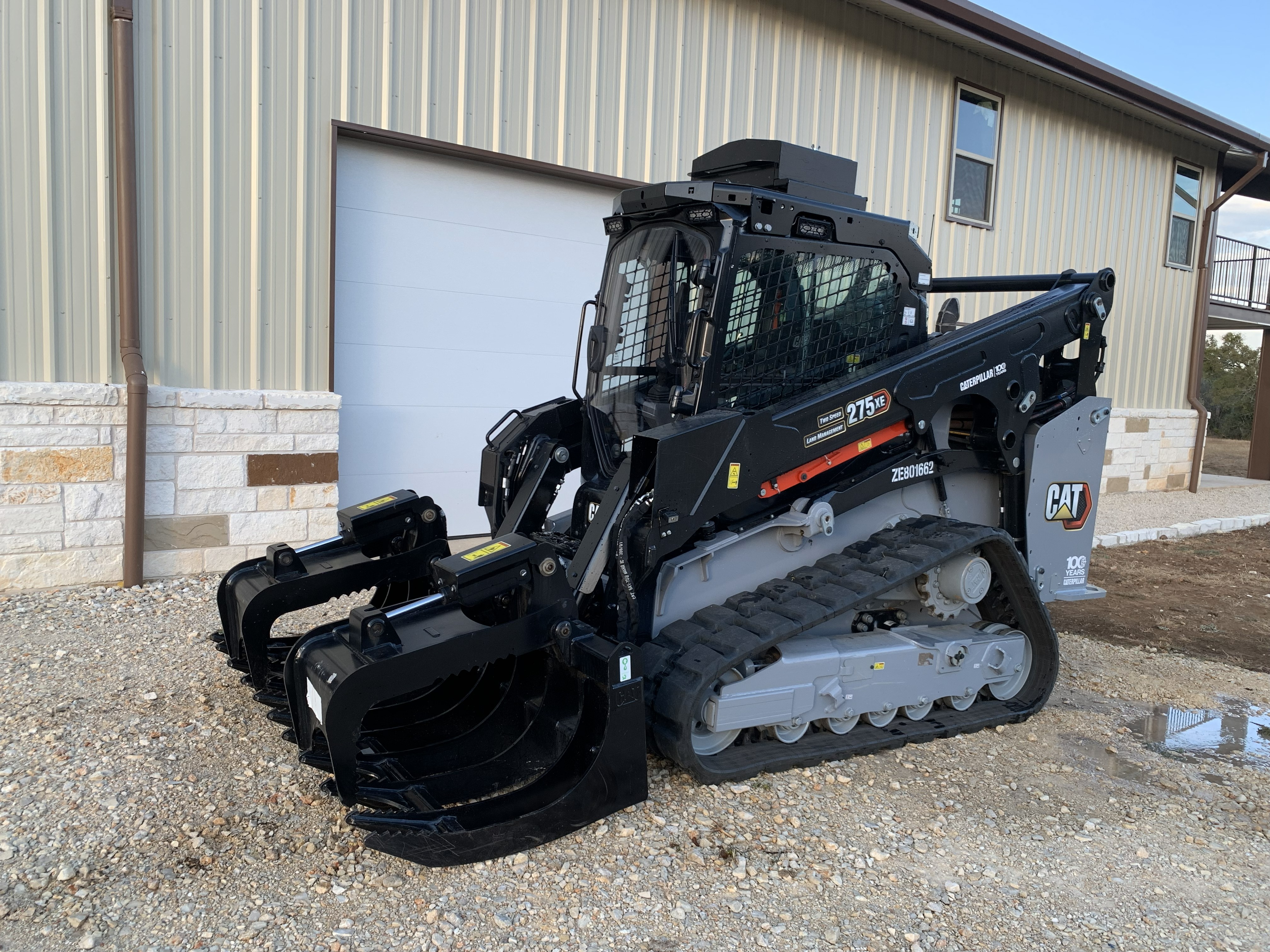EZS Ranch track loader with grapple